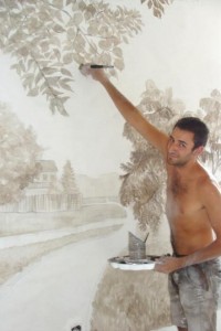 Martin an unemployed carpenter completes the wall murals - Sept 2012